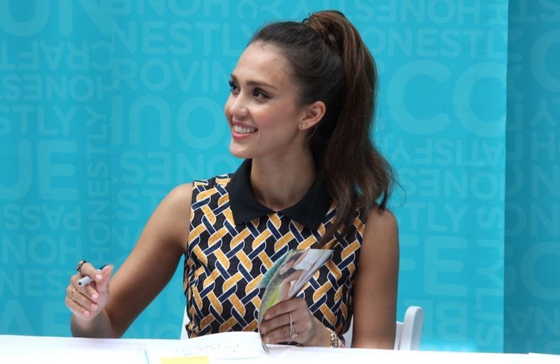 Jessica Alba signing a book